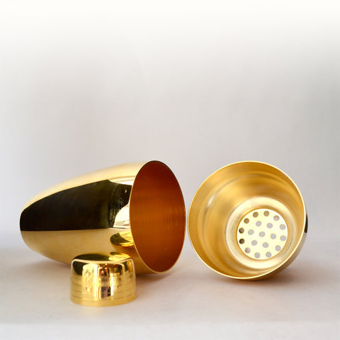 gold cobbler shaker In Japan, a three-piece cobbler shaker like this one is essential for the Hard Shake, a cocktail shaking technique created by legendary bartender Kazuo Uyeda. But for more practical reasons, this shaker is ideal for its smaller size-- it fits comfortably to your hand, and the lightness makes your 30-second shake more enjoyable and fun.